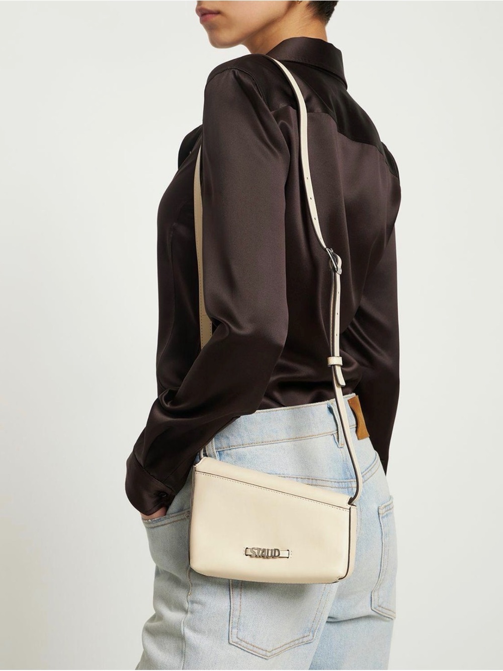 STAUD Acute Asymmetric Leather Crossbody Bag – Cream